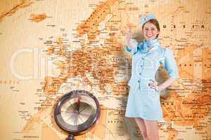 Composite image of pretty air hostess with hand on hip