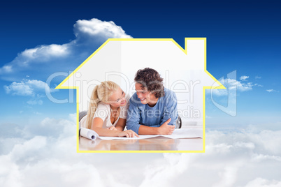 Composite image of smiling couple moving in a new house