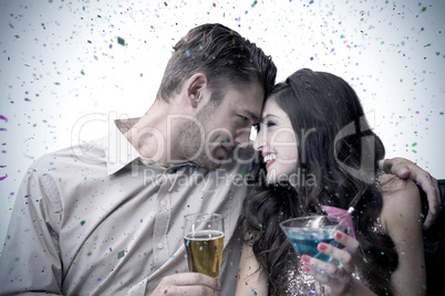 Composite image of cute couple drinking