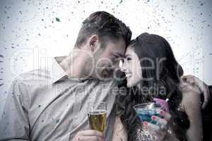 Composite image of cute couple drinking