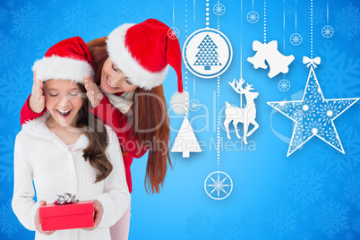 Composite image of mother and daughter with gift