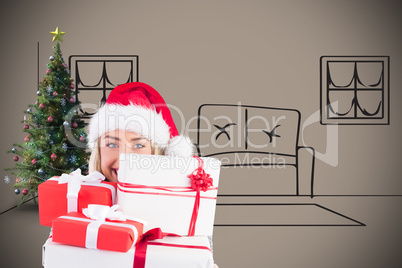 Composite image of festive blonde holding pile of gifts