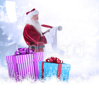 Composite image of father christmas writes a list