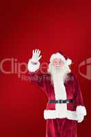 Composite image of jolly santa waving at camera