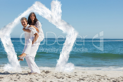 Composite image of smiling woman sitting on mans back and lookin