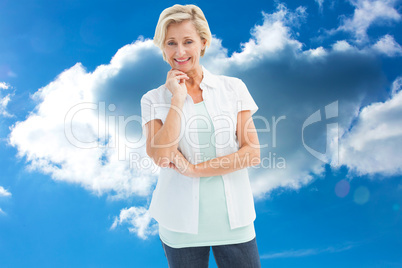 Composite image of happy mature woman smiling at camera Composite image of happy mature woman smiling at camera