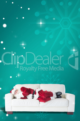 Composite image of father christmas sleeps on a couch