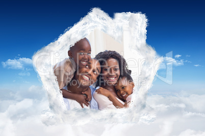 Composite image of happy family posing on the couch together