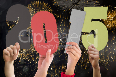 Composite image of hands holding poster Composite image of hands holding poster