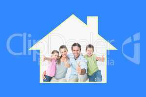 Composite image of cute family smiling at camera together showin