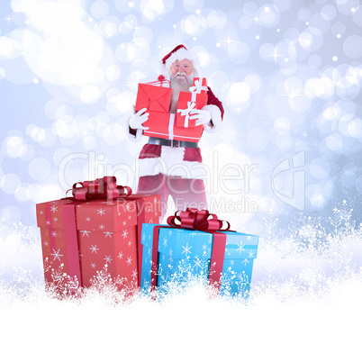 Composite image of santa carries a few presents