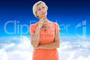Composite image of thinking older woman with arms crossed