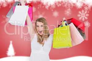 Composite image of blonde woman raising shopping bags