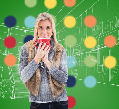 Composite image of woman in winter clothes holding a mug