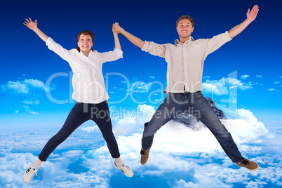 Composite image of couple jumping and holding hands