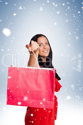 Woman standing with shopping bag