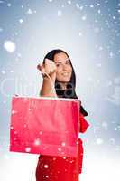 Woman standing with shopping bag