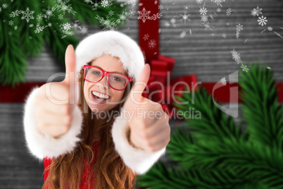 Composite image of festive redhead smiling at camera