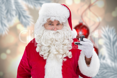 Composite image of cheerful santa holding a jewelry box