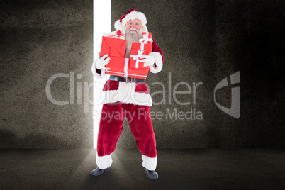 Composite image of santa carries a few presents Composite image of santa carries a few presents