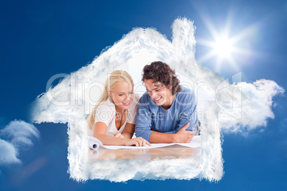Composite image of smiling couple getting ready to move in a new