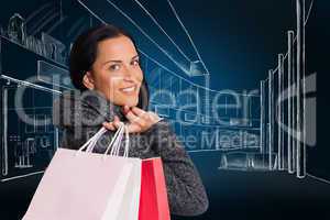 Composite image of smiling woman holding shopping bag