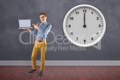 Composite image of geeky businessman showing his laptop