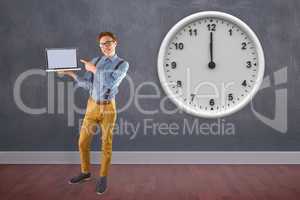 Composite image of geeky businessman showing his laptop