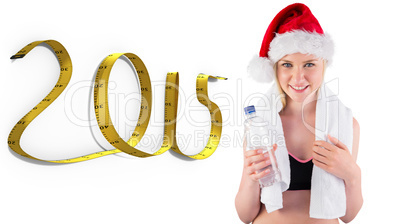 Composite image of festive fit blonde smiling at camera