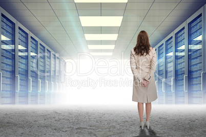 Composite image of rear view of businesswoman