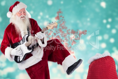 Composite image of santa claus has fun with a guitar