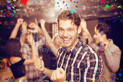 Composite image of stylish man smiling and dancing