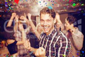 Composite image of stylish man smiling and dancing