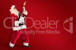 Composite image of santa playing electric guitar