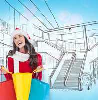 Composite image of festive brunette opening shopping bag