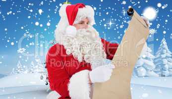 Composite image of santa checking list