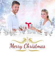 Composite image of  young couple with gift