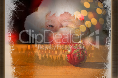 Composite image of santa claus winking