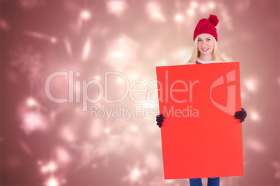 Composite image of festive blonde showing a red poster