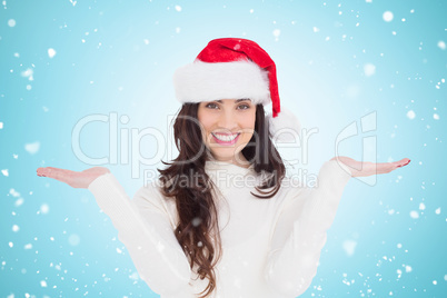 Composite image of festive brunette holding hands out