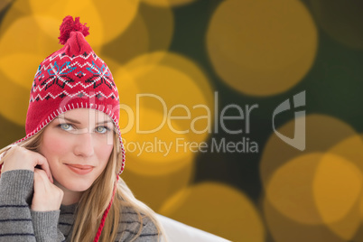 Composite image of woman sitting on couch