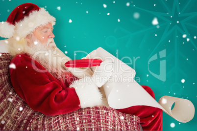 Composite image of father christmas writing list with a quill