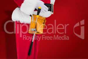 Composite image of santa claus with tool belt