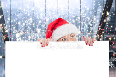 Composite image of festive blonde showing white poster