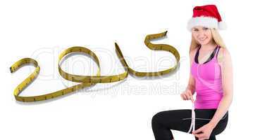 Composite image of fit festive young blonde measuring her thigh