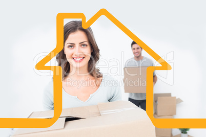 Composite image of pretty woman holding boxes in her new house