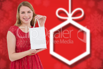 Composite image of pretty blonde in red dress holding a shopping