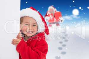 Composite image of festive little girl showing poster