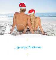Composite image of rear view of couple sitting on beach