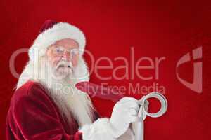 Composite image of father christmas writes a list